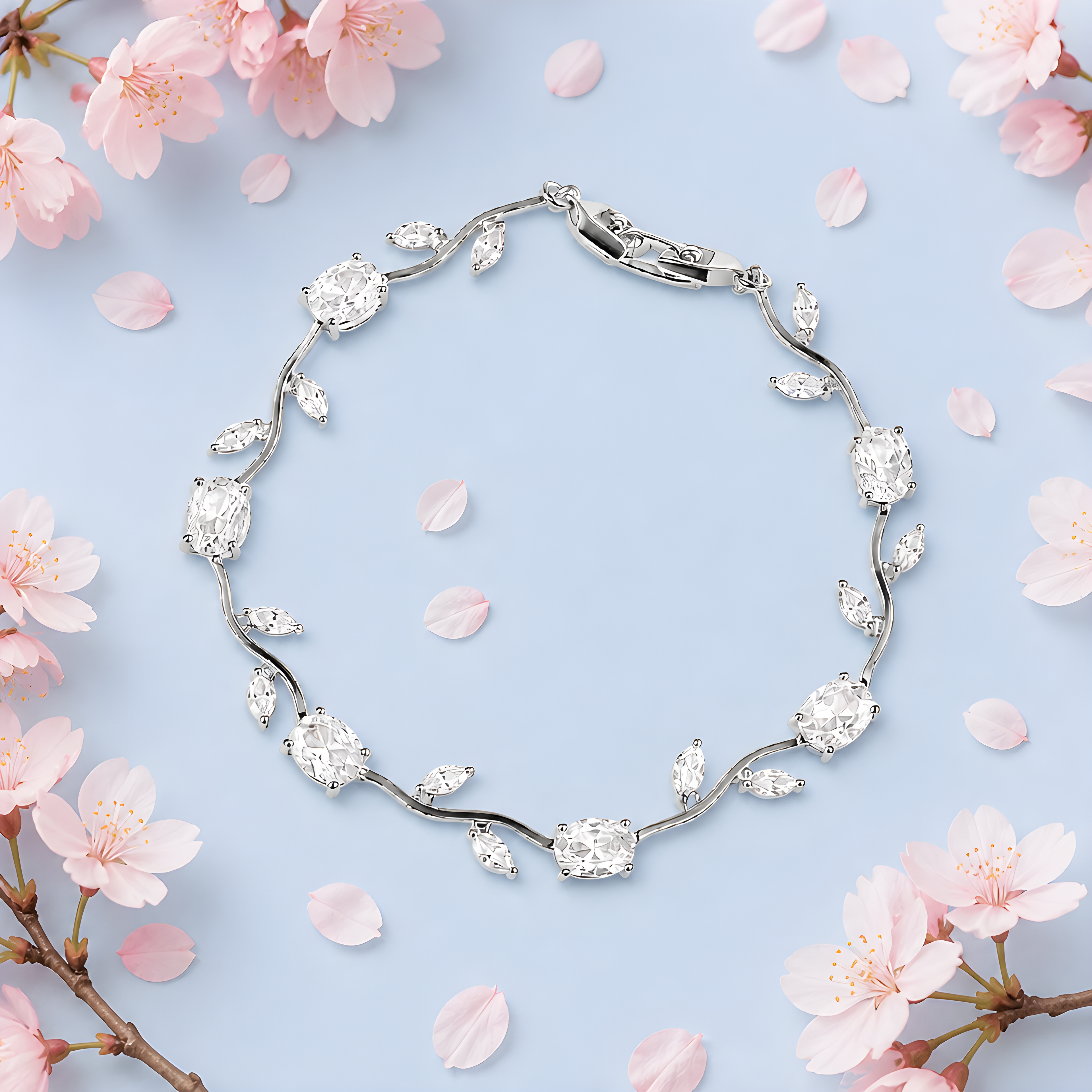 Tulipa White Armband in silberfarbener Ausführung auf hellblauem Hintergrund mit Kirschblüten, Lifestyle-Aufnahme