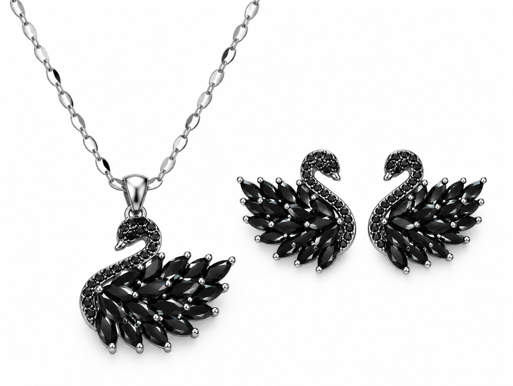Onyx Schwan-Set von Alextra Jewelry: silberfarbene Halskette mit schwarzem Schwan-Anhänger und zwei passende schwarze Schwan-Ohrstecker auf weißem Hintergrund